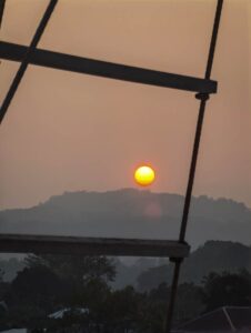 Hazy sun seen through the rigging of Scubaspa Zen