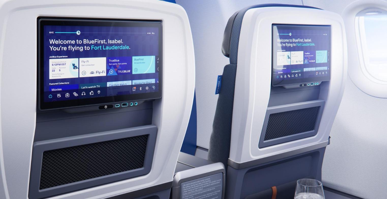JetBlue BlueFirst 13.3-inch seatback screens showing a welcome message for a flight to Fort Lauderdale