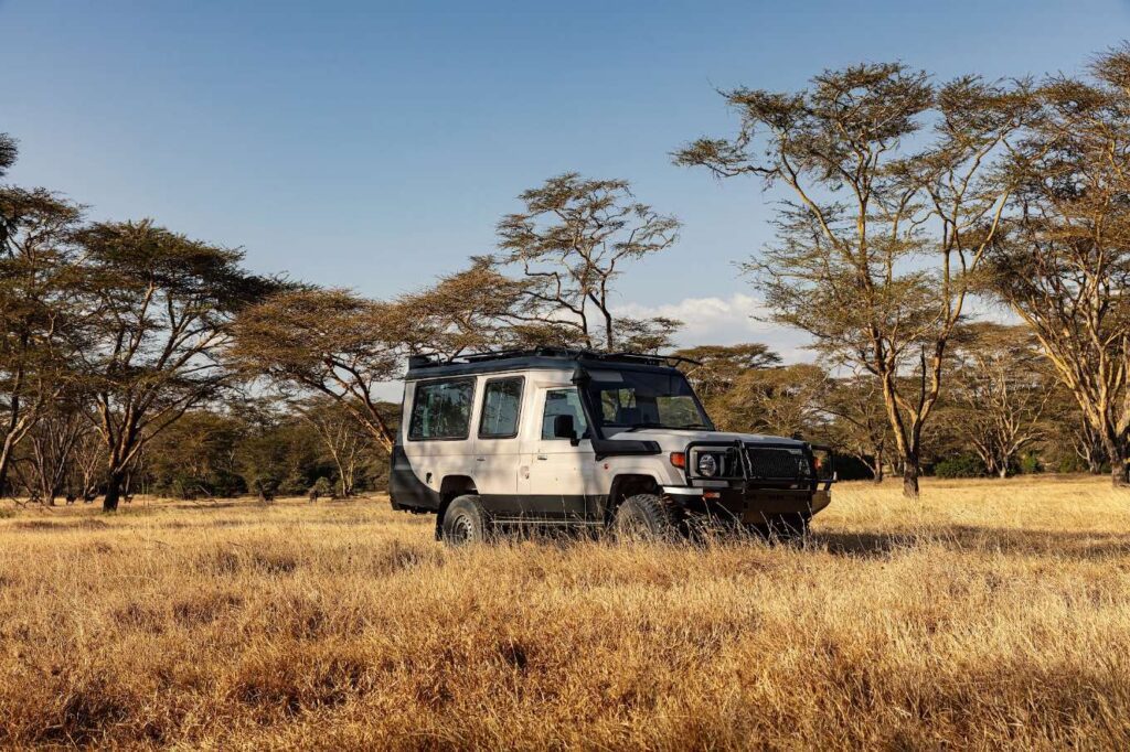 Safari vehicle on the savannah at Solio Game Reserve, Laikipia, Kenya