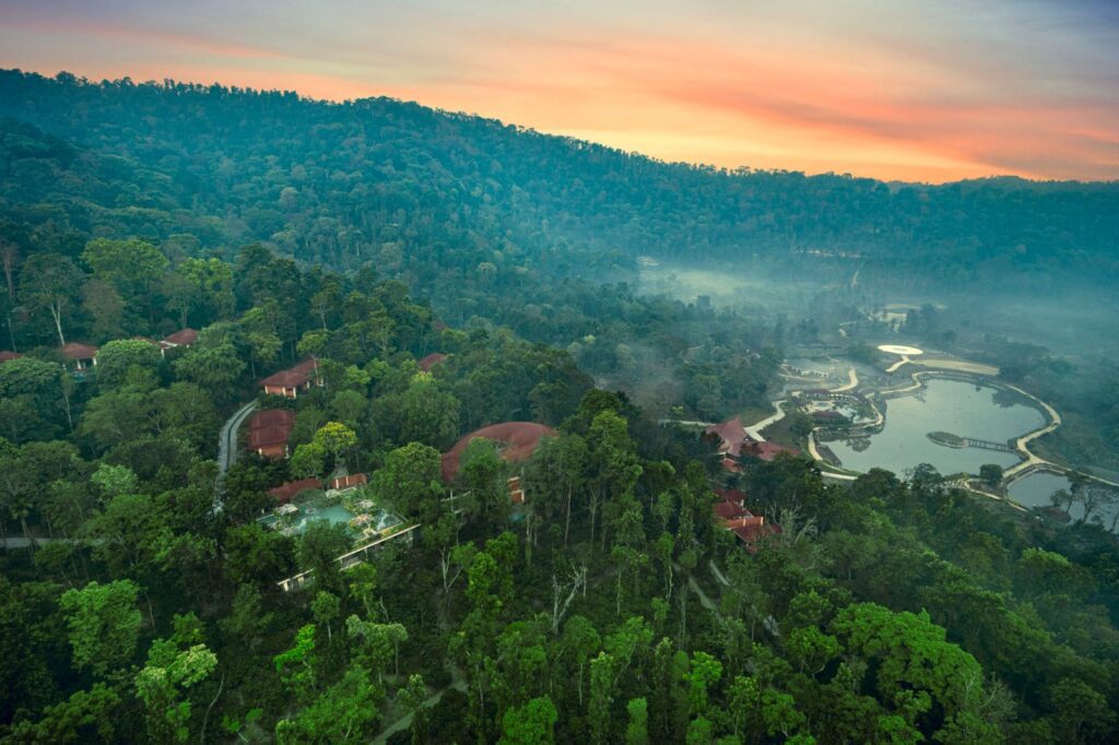 Aerial view of The Leela Coorg Forest Sanctuary across forest and coffee estate in Coorg, Karnataka