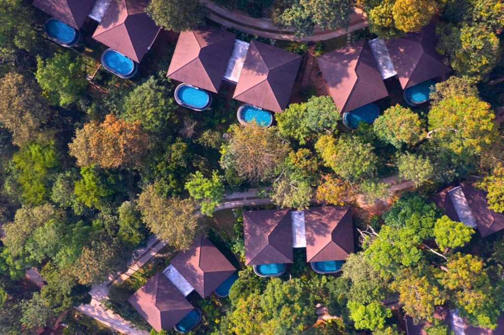 Villas of The Leela Coorg Forest Sanctuary from above, set in forest