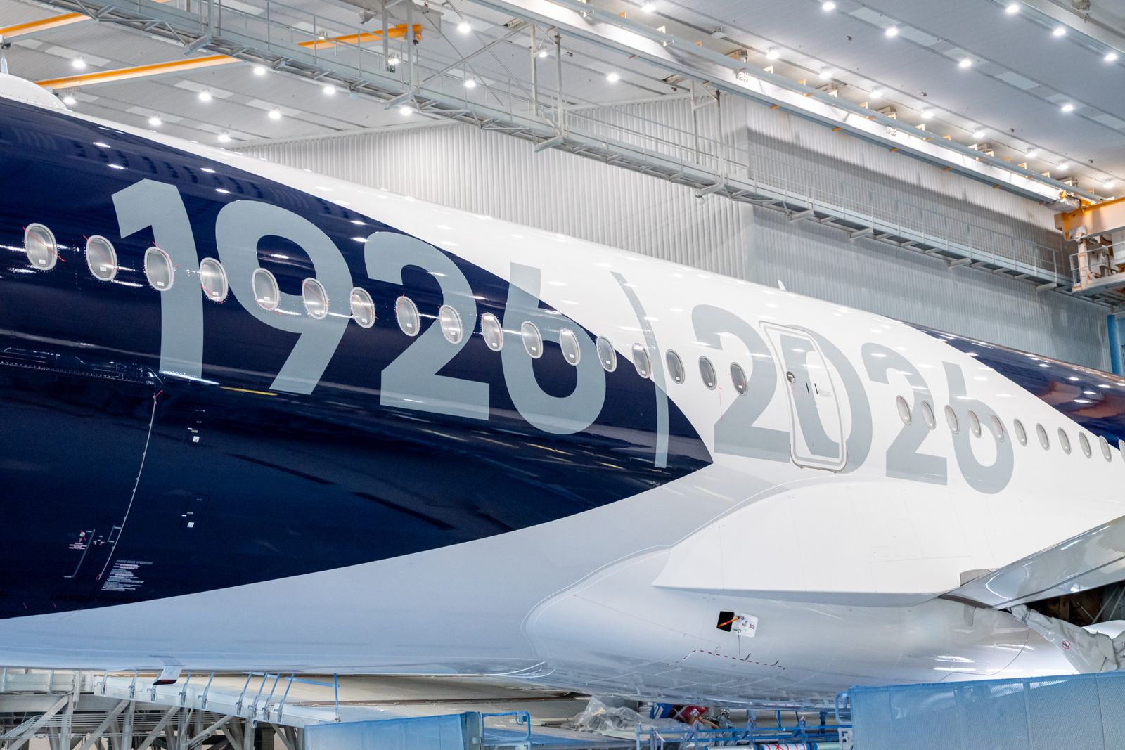 Close-up of the Lufthansa A350-1000 fuselage with the “1926 | 2026” centenary lettering on the deep-blue livery