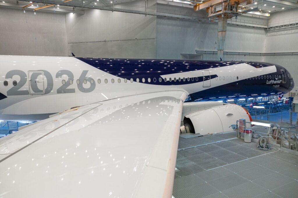Lufthansa A350-1000 D-AIFA in the paint hangar in Toulouse as the blue 100th-anniversary livery is unmasked