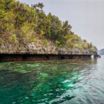 Karst island over a shallow reef in Misool
