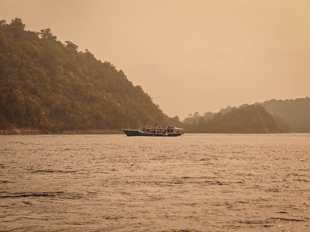 Karst islands of Misool in orange smoke haze, October 2026