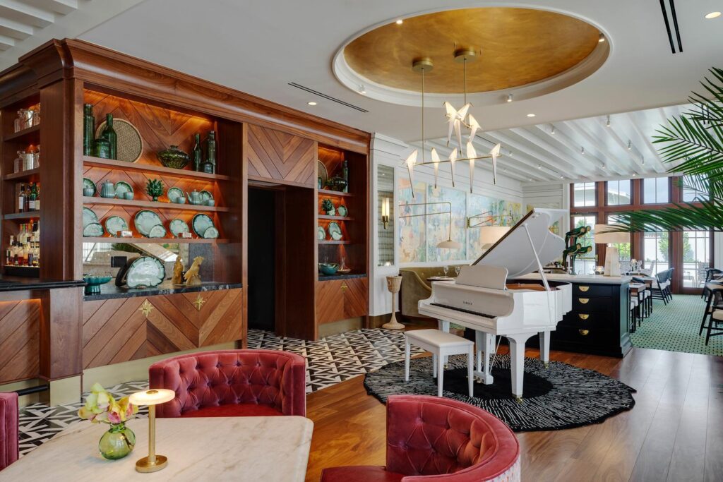Annie's bistro with piano and gilded ceiling dome at Olde Naples Hotel