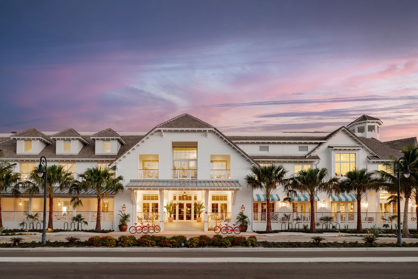 Olde Naples Hotel exterior at dusk on Broad Avenue South, Naples, Florida