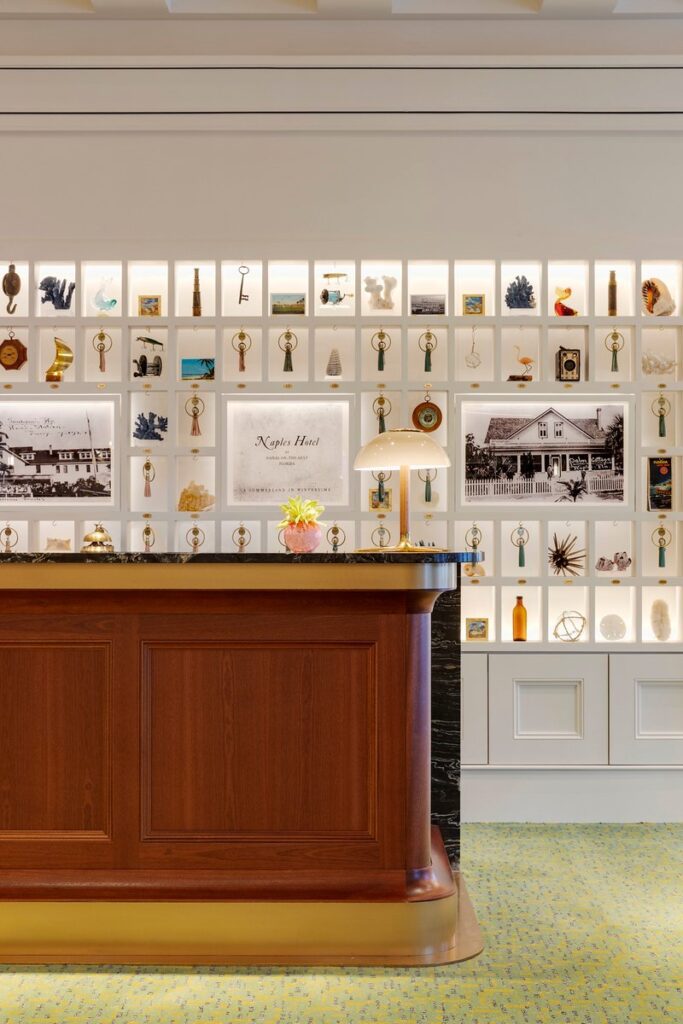 Vintage key-box wall of Naples artifacts in the Olde Naples Hotel lobby