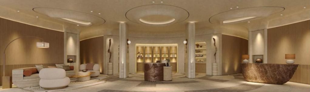 Rendering of the lobby at The Ritz-Carlton, AMAALA with arched alcoves and a sculptural stone reception desk