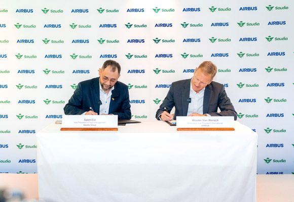 Saudia and Airbus executives signing at the Toulouse handover of the first Saudia A321XLR, the aircraft that introduced Saudia A321XLR business class