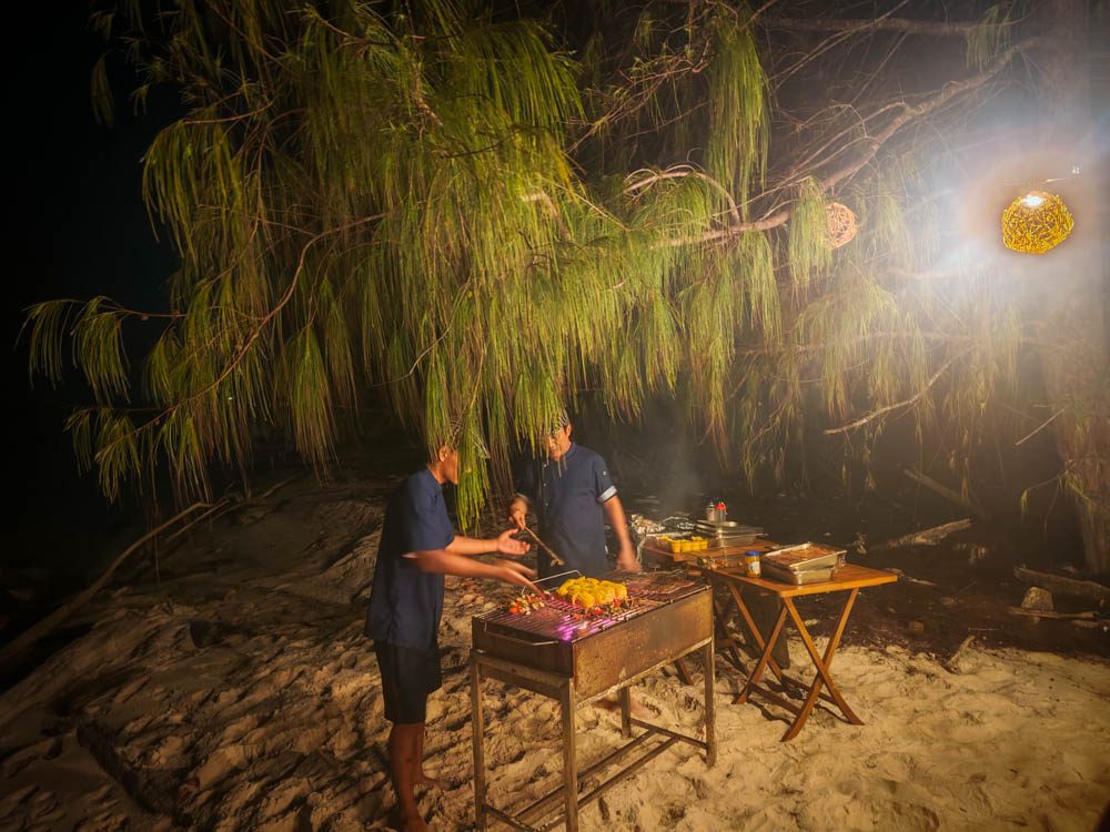 Crew grilling on the beach in Misool