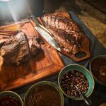 Grilled meats and sambals at the Scubaspa Zen beach barbecue