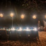 Long table lit by lanterns for the Scubaspa Zen beach barbecue