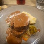 Plated beef dinner with mashed potato on Scubaspa Zen