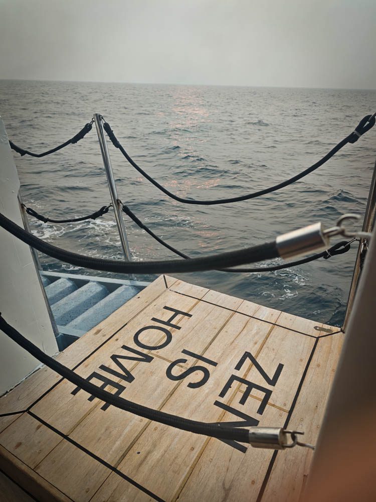 "Zen is home" sign on the Scubaspa Zen gangway platform