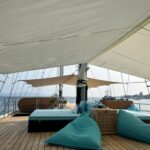 Beanbags and loungers under the shade sail on the Scubaspa Zen sundeck