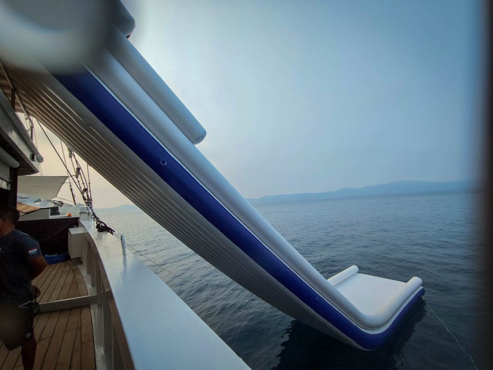 The inflatable water slide rigged off the side of Scubaspa Zen at Pulau Pisang